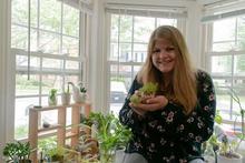 Maggie Deely holding plants